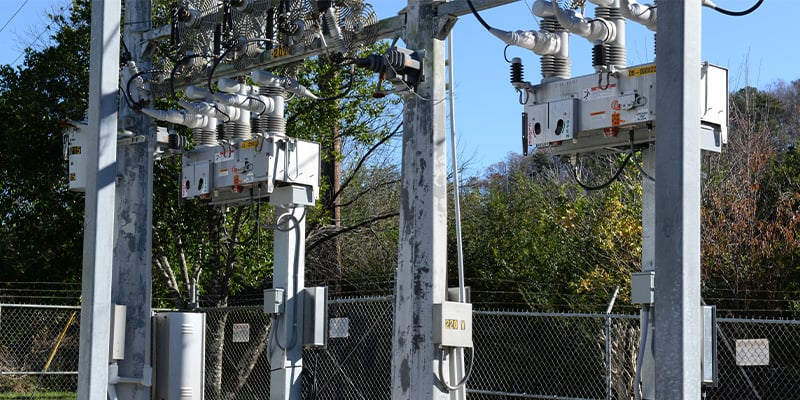 S&C’s IntelliRupter® PulseCloser® Fault Interrupter mounted on a pole inside a substation.
