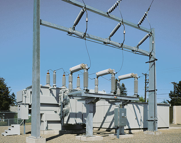 Daytime photo of a Series 2000 Circuit-Switcher installed at a fenced in substation Series 2000, Circuit Switcher, Substation, fault interrupting, transformer switching, protection