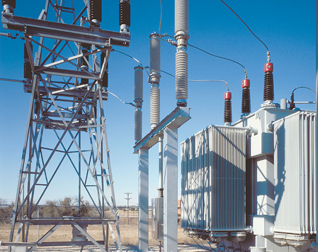 Daytime photo of a Series 2000 Circuit-Switcher installed at a fenced in substation lineup Series 2000, Circuit Switcher, Substation, fault interrupting, transformer switching, protection